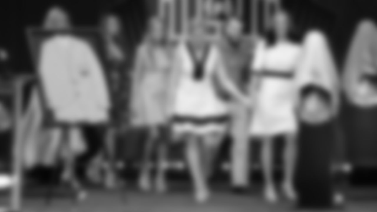 Brittany Bowlen and Beth Bowlen Wallace walk out to the front of the stage with Amie Klemmer, Christianna Bowlen, Annabel Bowlen and Patrick Bowlen Jr. at the 2019 Pro Football Hall of Fame enshrinement ceremony on August 3, 2019 in downtown Canton, Ohio.
