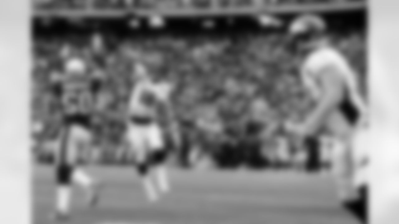 QB Peyton Manning throws downfield for TE Joel Dreessen.