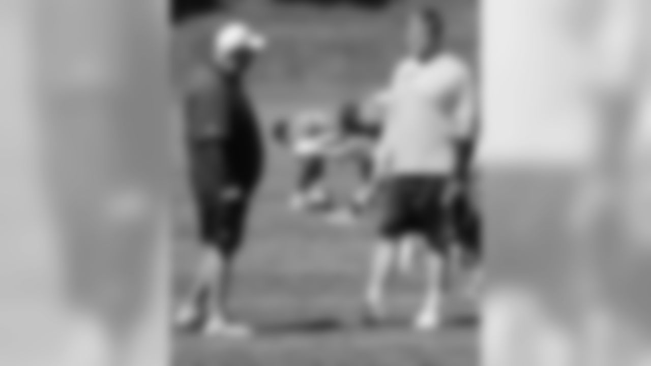G Chris Kuper talks to OL Coach Dave Magazu.