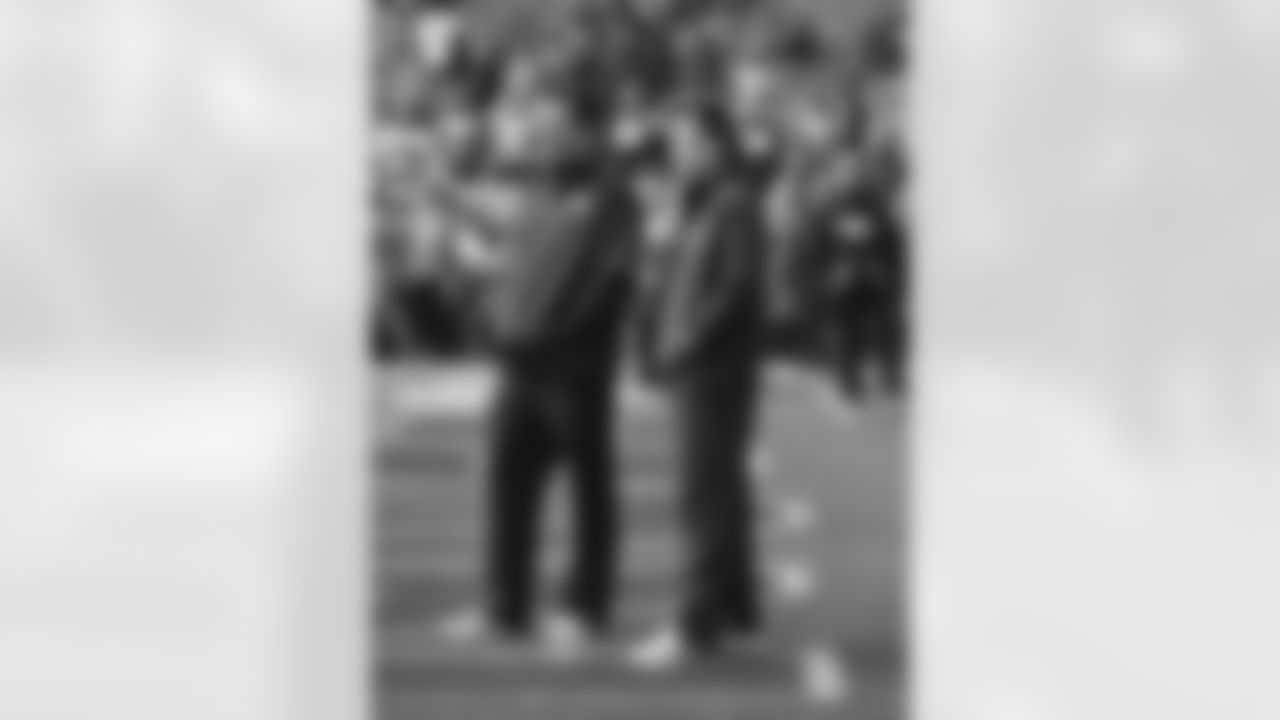 Denver Broncos Head Coach Gary Kubiak with quarterbacks coach Greg Knapp during pregame warmups prior to kickoff against the Oakland Raiders in the NFL game at Sports Authority Field in Denver, Colo. January 1, 2017.
