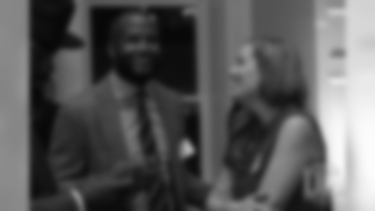 Brittany Bowlen talks with Champ Bailey at the Pro Football Hall of Fame's Celebration of Excellence Reception in Atlanta on January 31, 2019.
