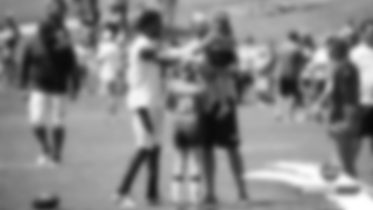 Emmanuel Sanders greets Wide Receivers Coach Zach Azzanni's daughters at practice on Day 5 of training camp on July 22, 2019.