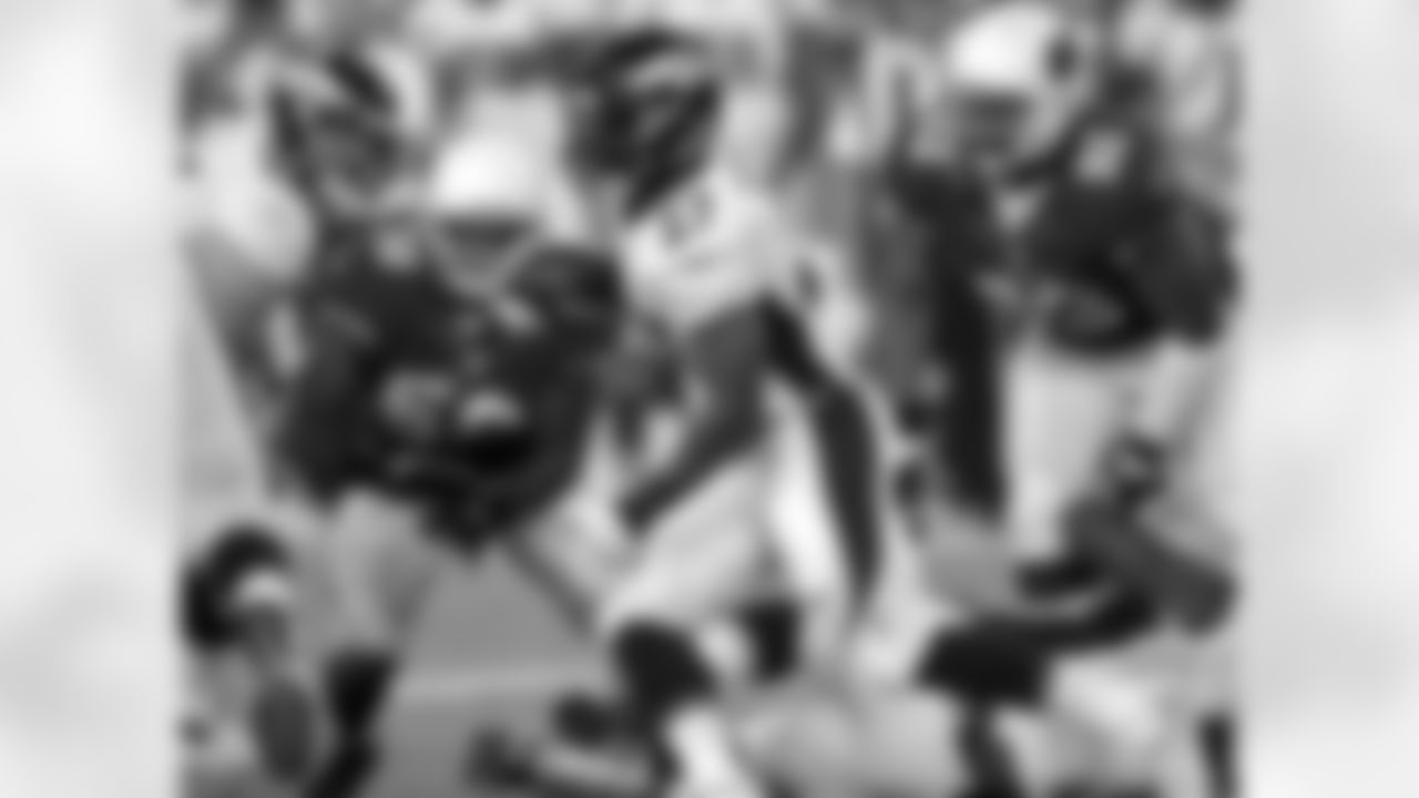 Running back Knowshon Moreno fights for yardage against the Arizona Cardinals.