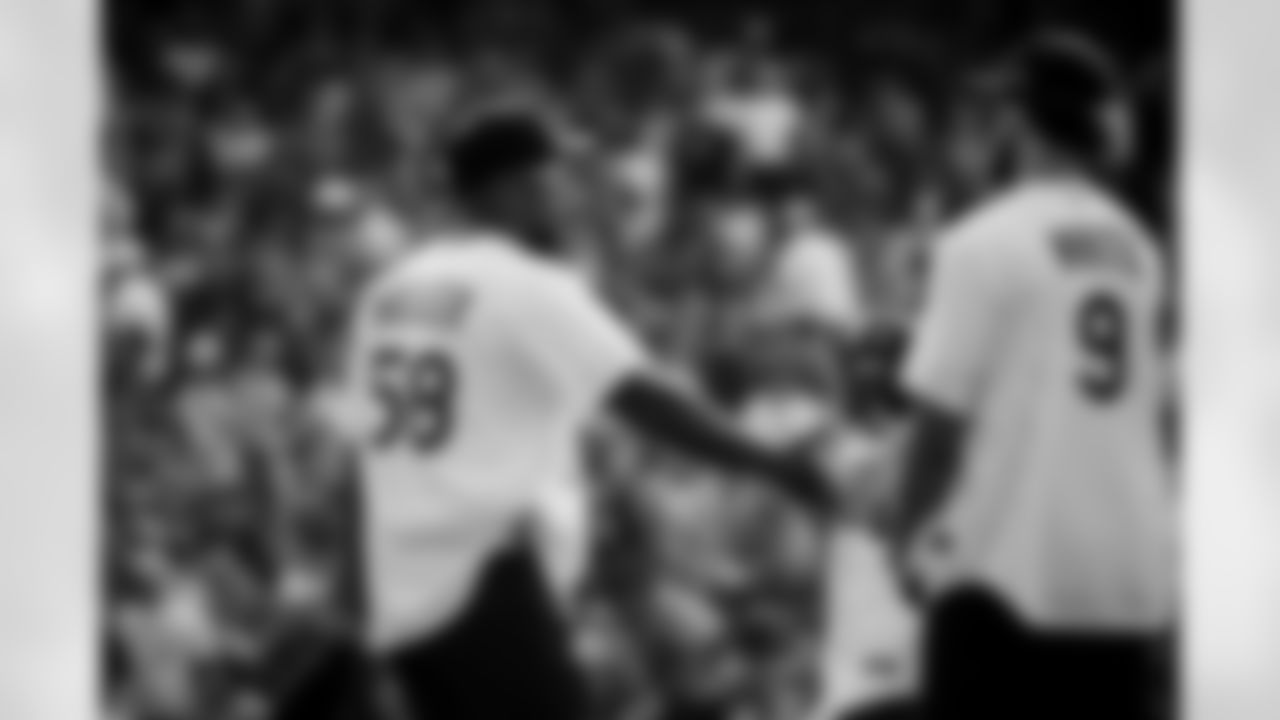 Von Miller greets NBA player Derrick White at the 2021 MLB All-Star Celebrity Softball Game at Coors Field on July 11, 2021. (Photo by Ben Swanson)