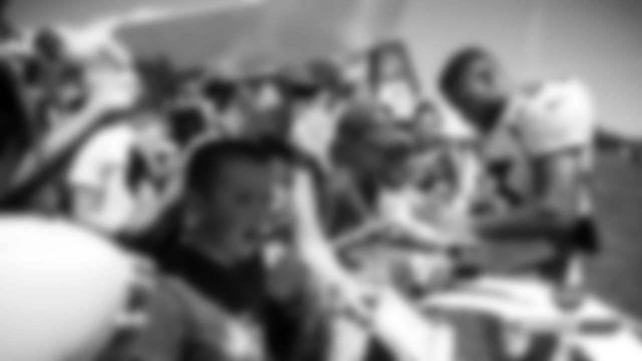 Khalfani Muhammad signs autographs after practice on Day 12 of training camp on August 4, 2019.