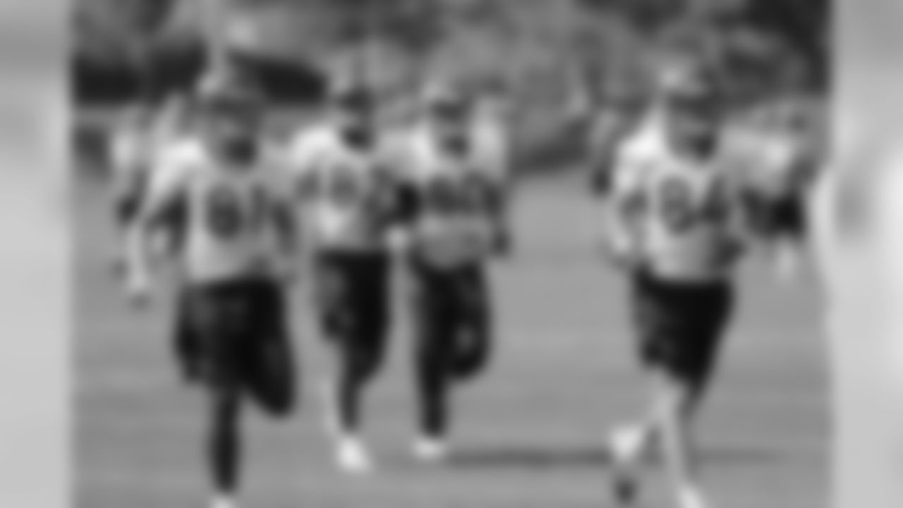 The tight ends head to their first drill of practice.