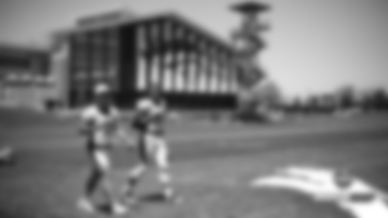 River Cracraft and Noah Fant walk off the field after practice on Day 5 of training camp on July 22, 2019.