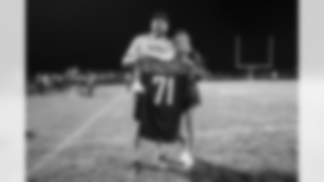 Dalton Risner and his fiancé at Dalton Risner's jersey retirement ceremony at Wiggins High School in Wiggins, CO on September 2, 2021.