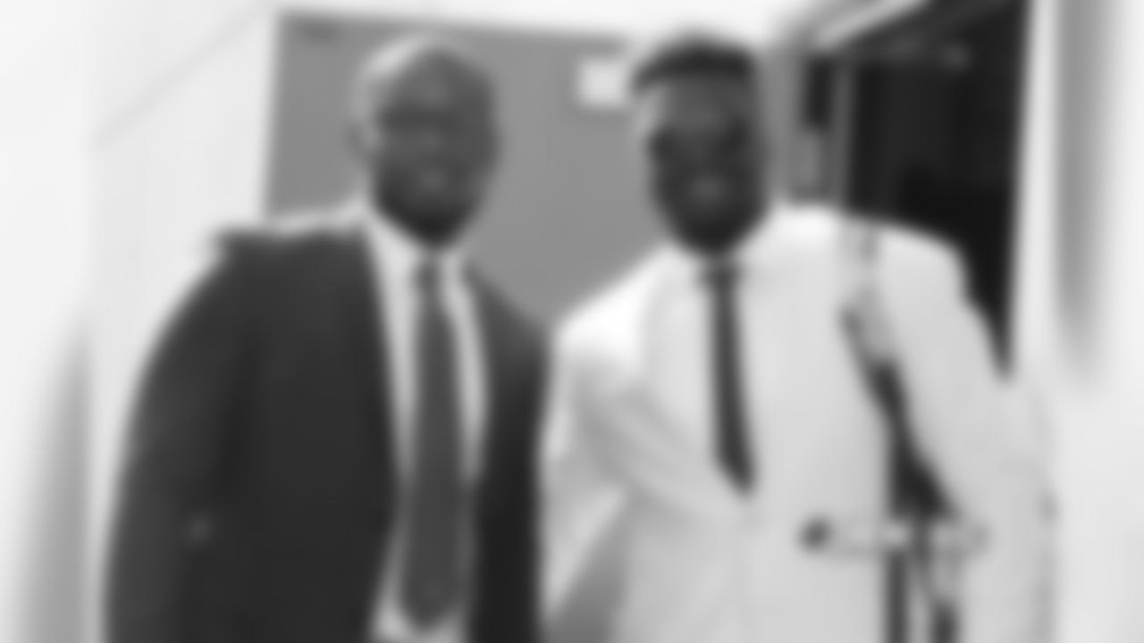 Keishawn Bierria and Shaquil Barrett walks to the buses during the team's travel for their Week 8 game against the Kansas City Chiefs on October 27, 2018.