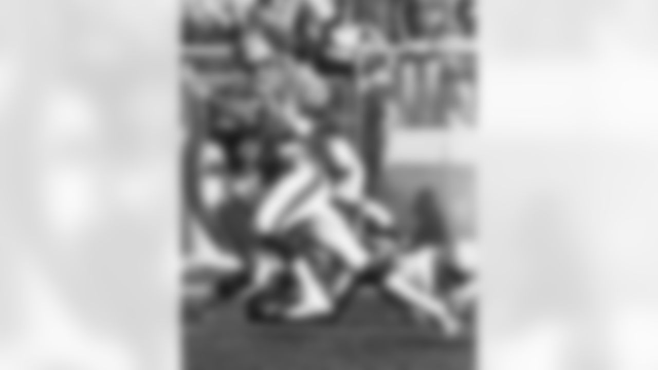 Rick Upchurch runs with the ball during a game against the Seahawks.