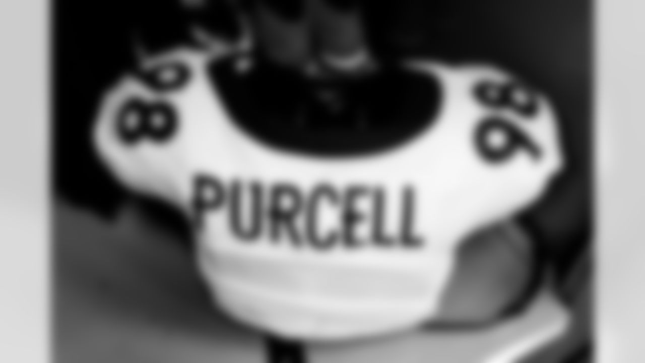 Mike Purcell's jersey in the locker room before the Broncos' Week 7 game against the Cleveland Browns at FirstEnergy Stadium in Cleveland, Ohio on October 21, 2021. (Photo by Joe Abdellah)