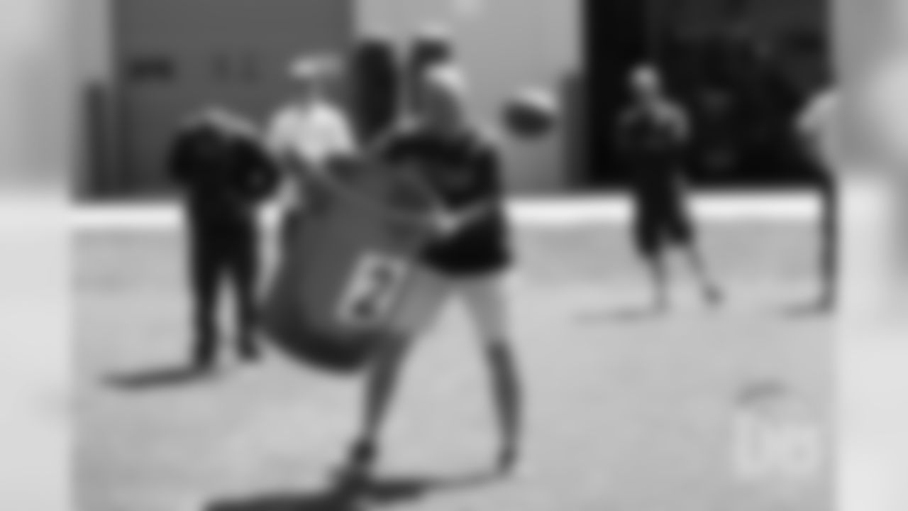 Head Coach Vic Fangio moves one of the trash cans during the football toss during the Broncos field day on June 6, 2019.