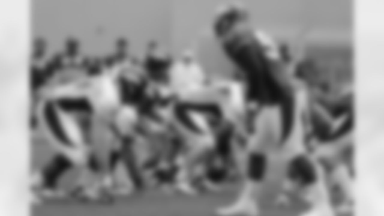Manning takes a snap.
