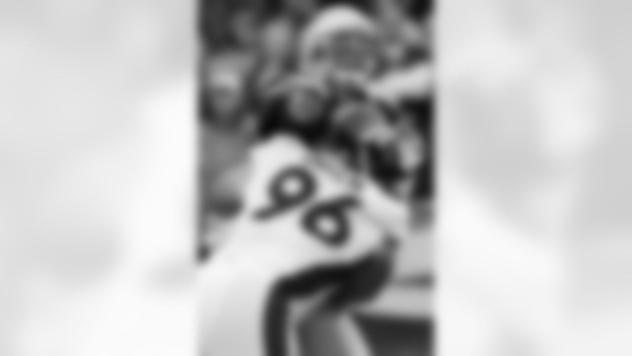 DT Mitch Unrein puts a big hit on New England quarterback Tom Brady.
