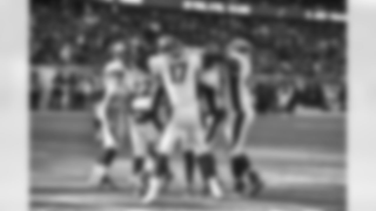Denver Broncos quarterback Brock Osweiler (17) celebrates with his offense after throwing a 10 yard pass to Cody Latimer for a touchdown at 11:47 of the fourth quarter against the Chicago Bears in the NFL game in Chicago, ILL.November 22, 2015. (© Eric Lars Bakke/ Denver Broncos)