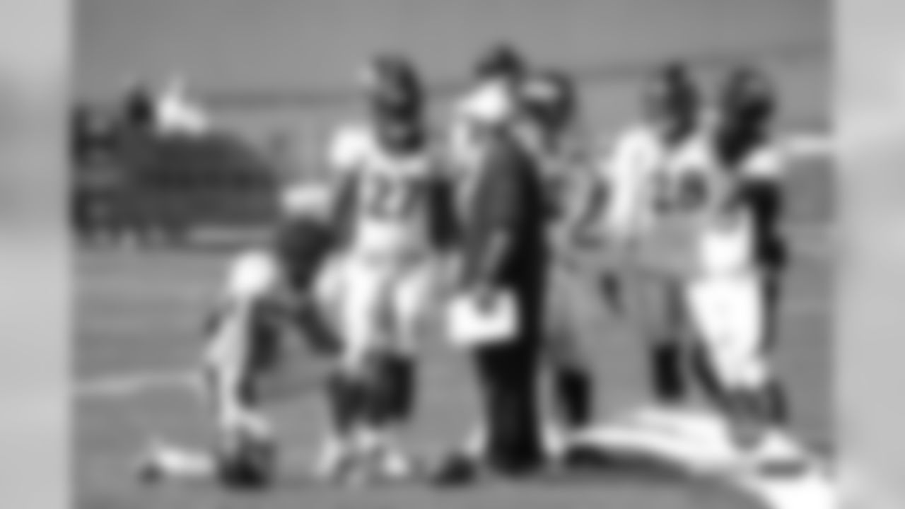 Phillip Lindsay, Theo Riddick, Devontae Booker, Royce Freeman, Devontae Jackson and other running backs with Running Backs Coach Curtis Modkins during practice on Day 12 of training camp on August 4, 2019.