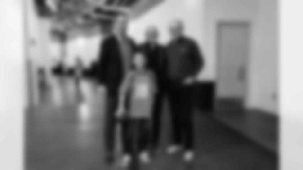 Peyton Manning with his father Archie and son Marshall and former Broncos head coach John Fox during a Ring of Fame ceremony before the Broncos' Week 8 game against the Washington Football Team at Empower Field at Mile High in Denver, Colorado on October 31, 2021. (Photo by Gabriel Christus)