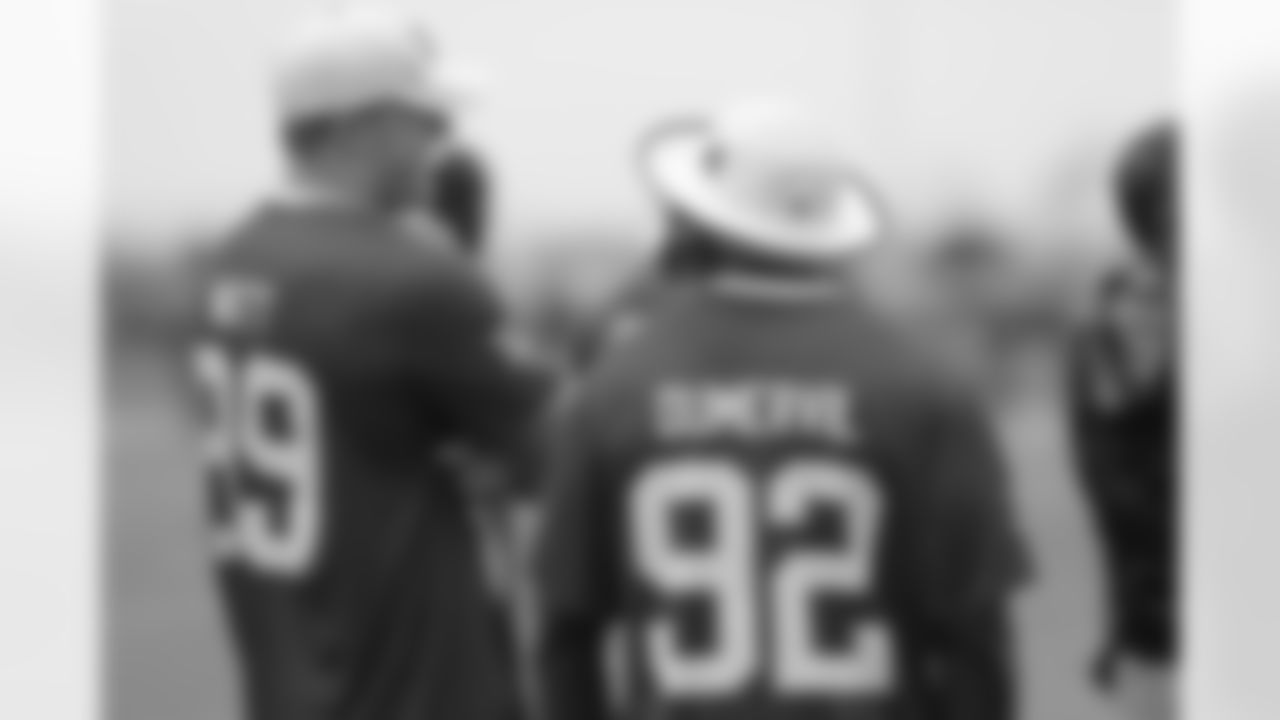 Dumervil and Watt talk during practice.