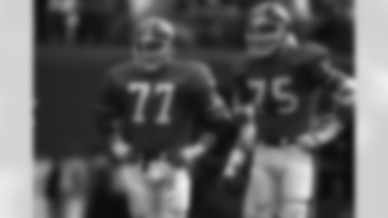 Denver Broncos linebacker Karl Mecklenburg and defensive end Rulon Jones (75) await the Dallas Cowboys offense during an NFL game in Denver, Oct. 5, 1986. The Broncos defeated the Cowboys 29-14. (AP Photo/Eric Lars Bakke)