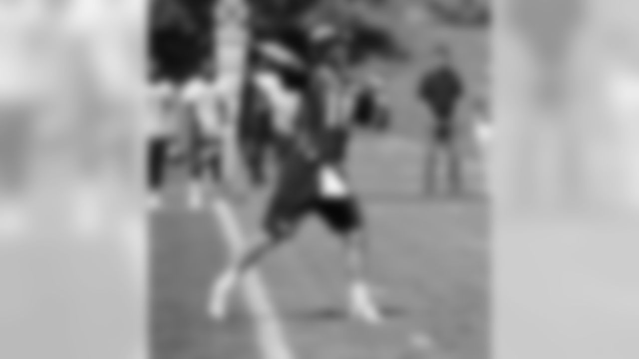 Manning throws a pass downfield.