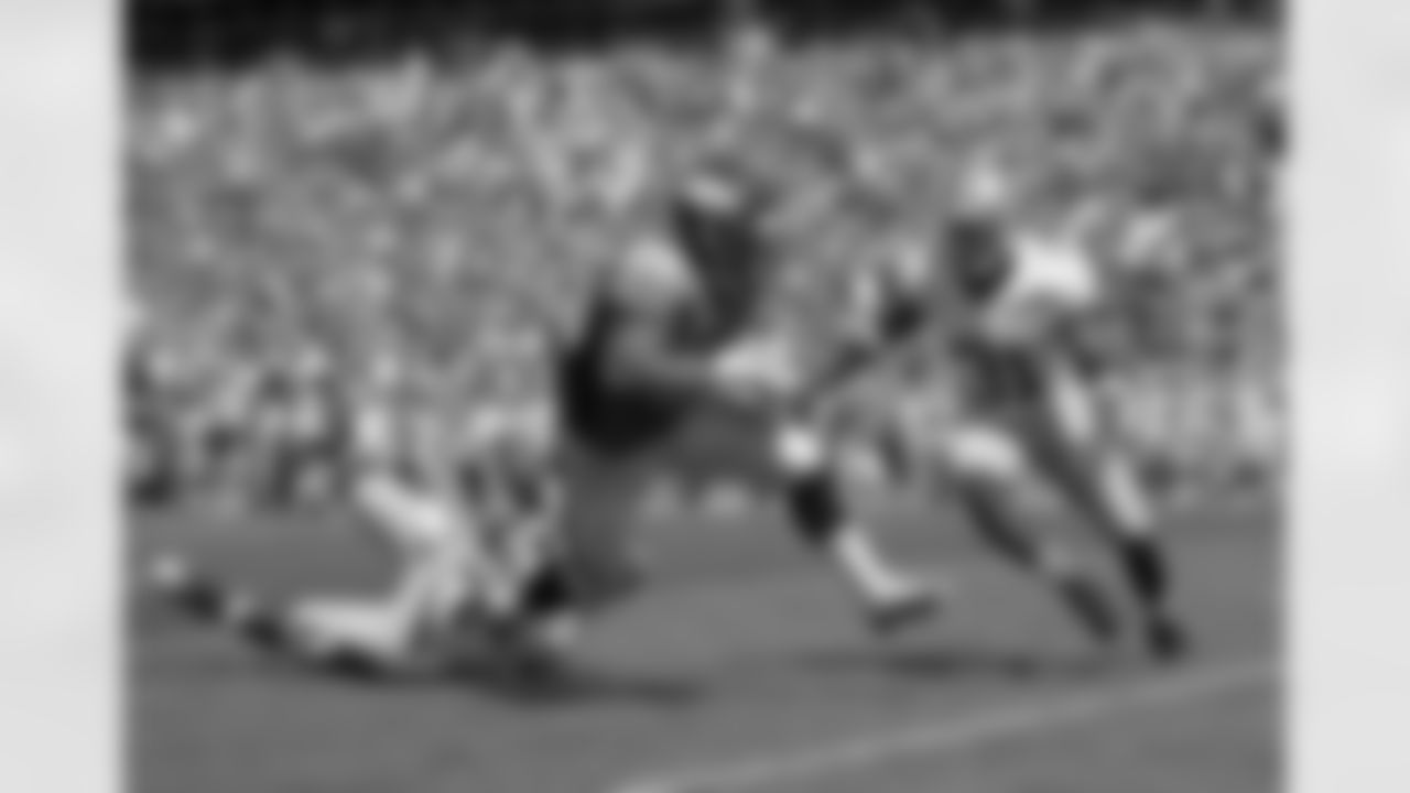 Running back Lance Ball fights for extra yardage.