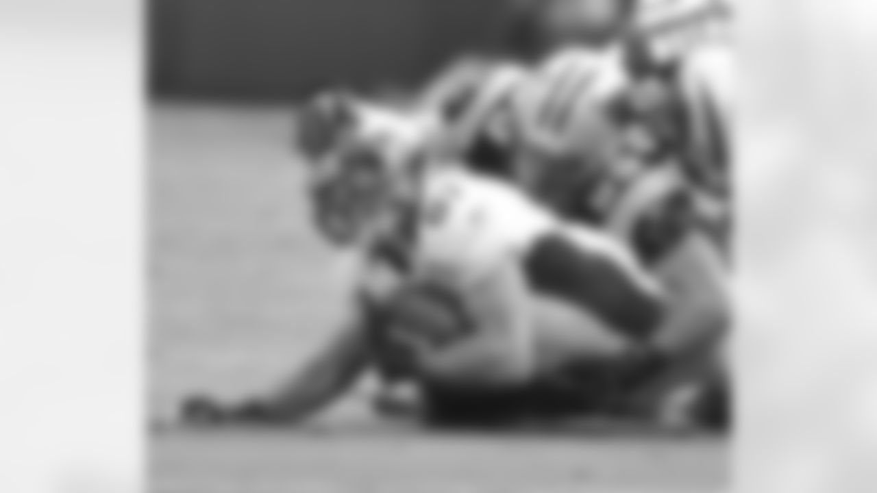 Decker is dragged down after a catch.