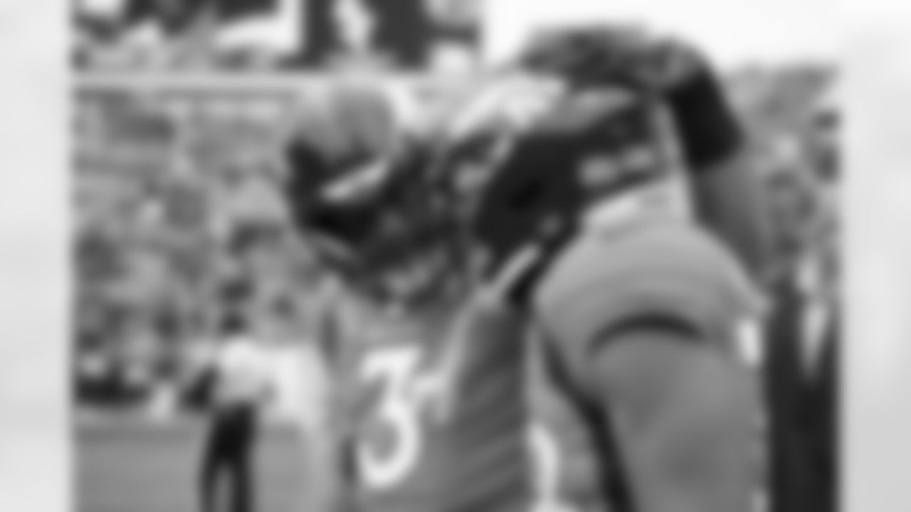 Denver Broncos quarterback Russell Wilson (3) and running back Jaleel McLaughlin (38) before the Broncos' Week 8 game against the Kansas City Chiefs at Empower Field at Mile High in Denver, Colorado on October 29, 2023. Photo by Ben Swanson / Denver Broncos