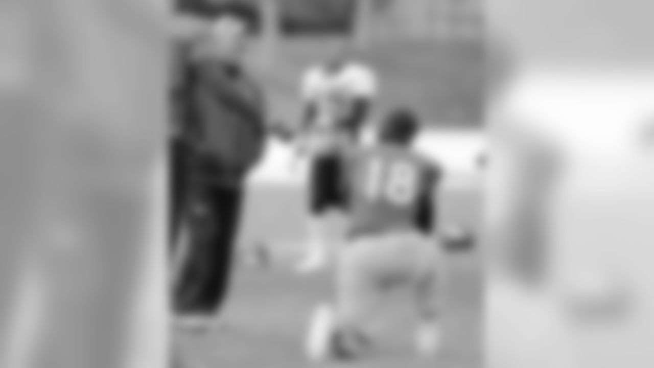 Head Coach John Fox laughs with QB Peyton Manning.