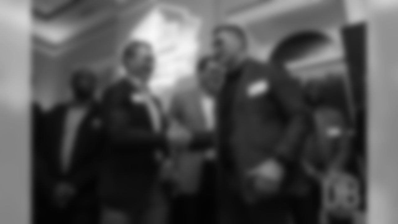 John Lynch greets Kevin Mawae during a presentation of the Hall of Fame finalists at the Pro Football Hall of Fame's Celebration of Excellence Reception in Atlanta on January 31, 2019.