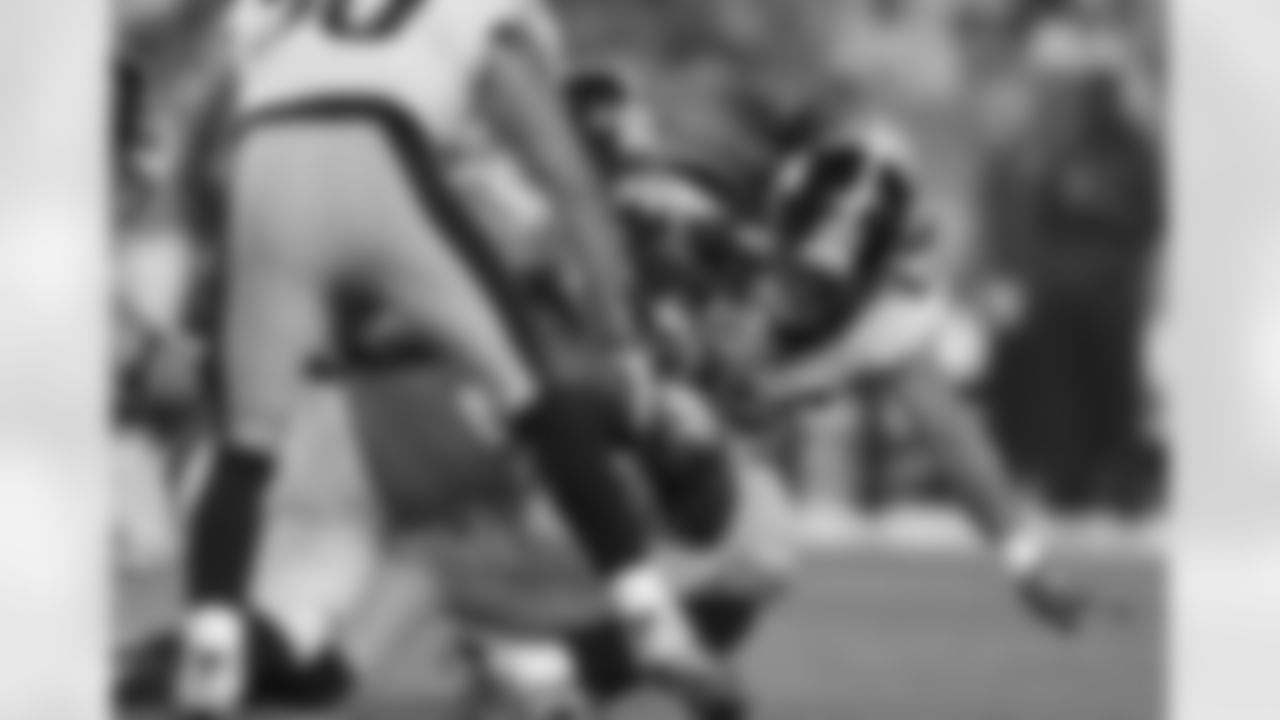 McGahee stretches for an extra yard.