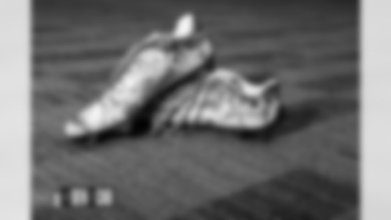 Pat Surtain II's cleats in the locker room before the Broncos' Week 12 game against the Carolina Panthers at Bank of America Stadium in Charlotte, North Carolina on November 27, 2022. (Photo by Gabriel Christus)
