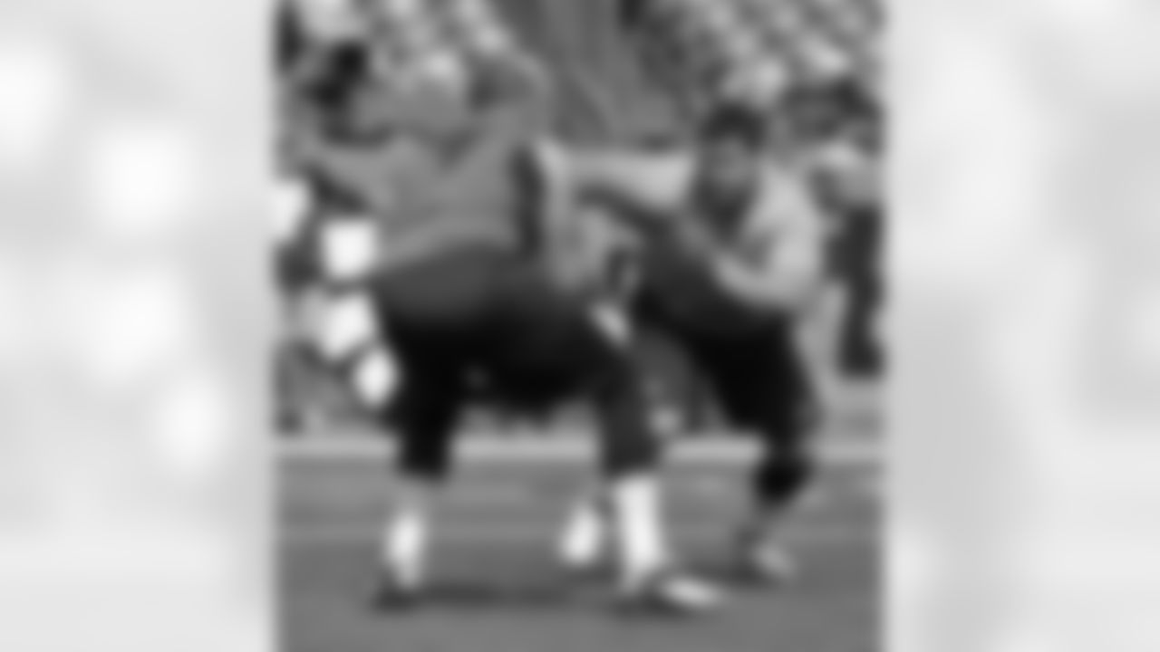 The pair of young defensive linemen work against each other as they get loose for Sunday's contest.