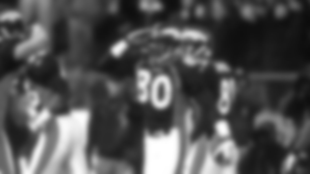 Rod Smith salutes a teammate after scoring a touchdown on a 43-yard reception during the Broncos' 42-17 win over the Jacksonville Jaguars in the Wild Card round of the 1997 playoffs on December 27, 1997 at Mile High Stadium.