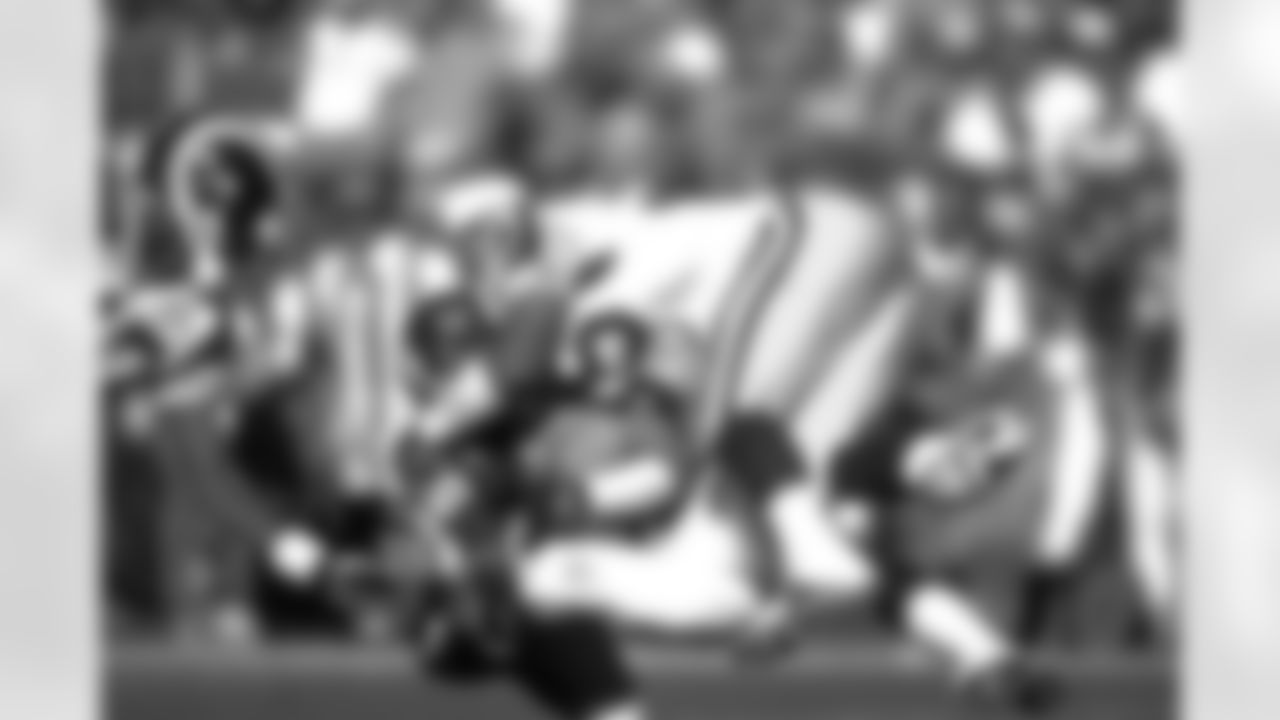 Denver: Ed McCaffrey gets tackled after making a touchdown catch against the St. Louis Rams at Mile High Stadium in Denver, CO on September 14, 1997.