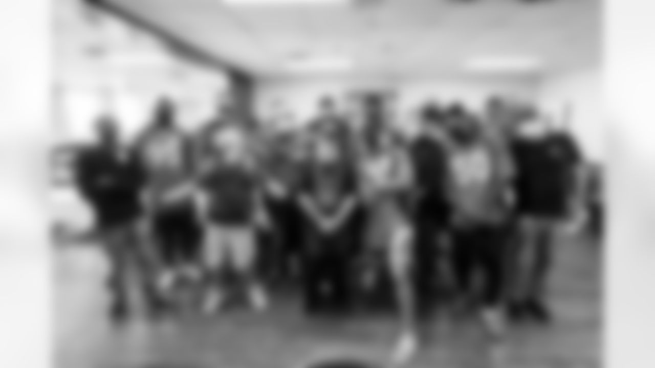 McTelvin Agim, Dalton Risner, Lloyd Cushenberry III, Netane Muti, Justin Simmons, Quinn Meinerz and Jonas Griffith help prepare and serve meals at Denver Rescue Mission in Denver, Colorado on October 5, 2021. (Photo by Sam Weaver)