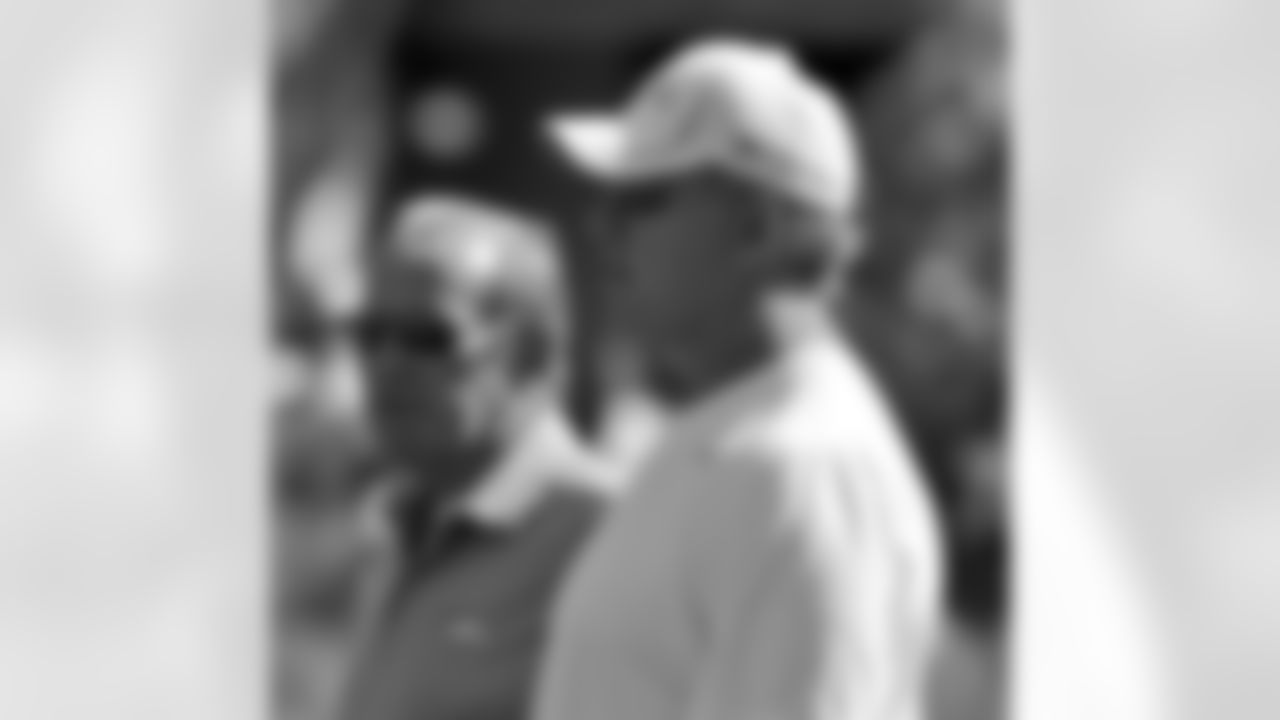Owner Pat Bowlen and EVP of Football Ops. John Elway watch Saturday's Summer Scrimmage.