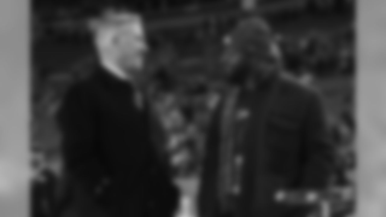 President of Football Operations/General Manager John Elway talks with Al Wilson before the Broncos' Week 15 game against the Cleveland Browns at Broncos Stadium at Mile High on December 15, 2018.