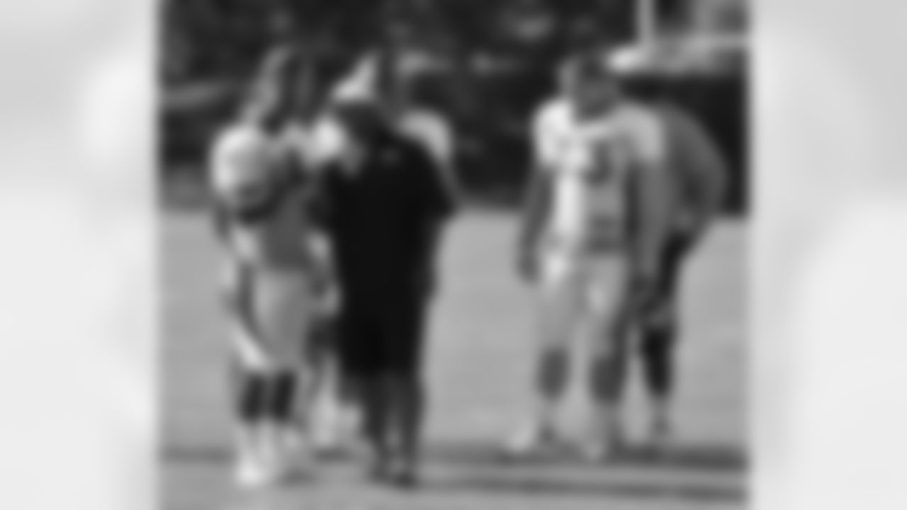 RB Willis McGahee talks to Running Backs Coach Eric Studesville.