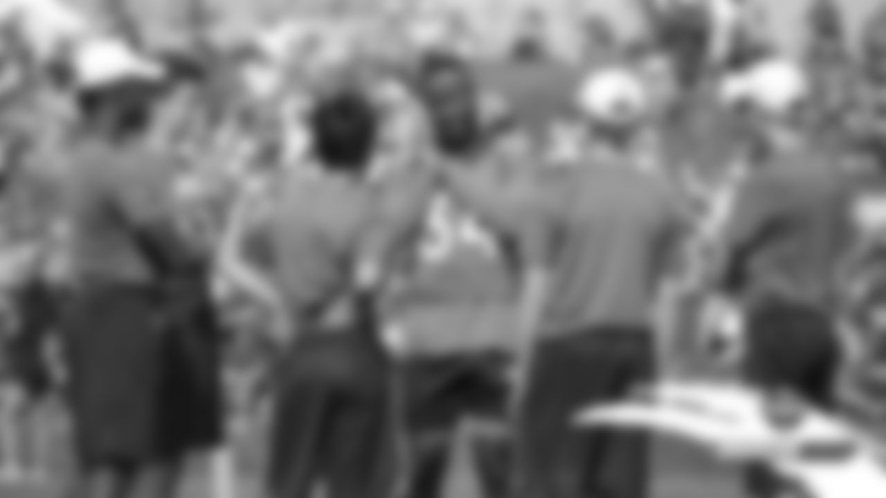 Will Parks talks with some of the camp volunteers during practice on Day 11 of training camp on July 30, 2019.