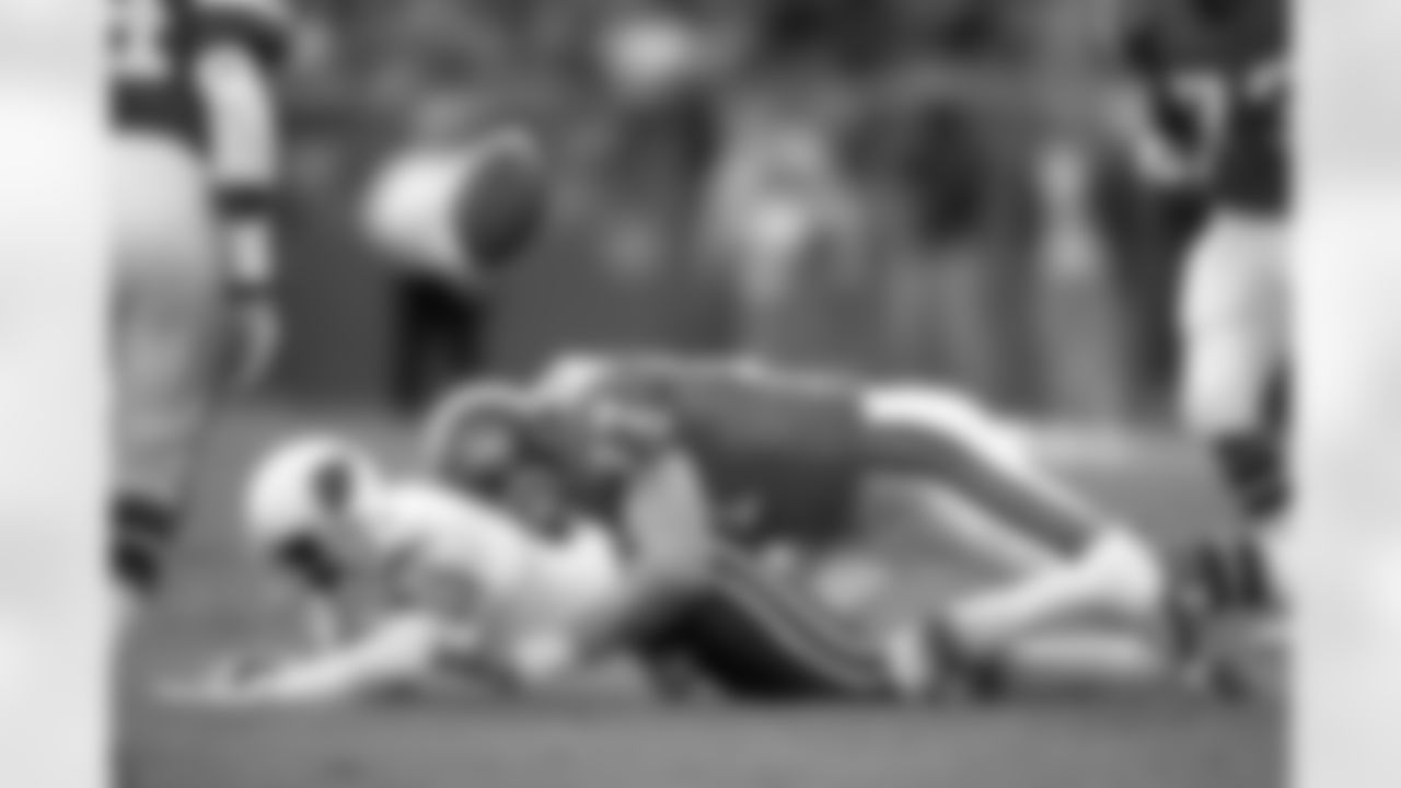 Linebacker Karl Mecklenburg knocks the ball away from a Cardinal receiver during a December 15, 1991 win (24-19) against Arizona.
