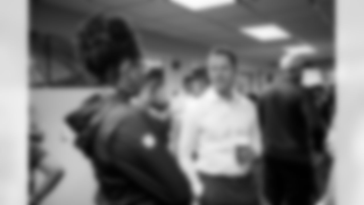 General Manager George Paton speaks with Broncos staff members during a visit to Empower Field at Mile High in Denver, Colorado on September 29, 2021. (Photo by Ben Swanson)
