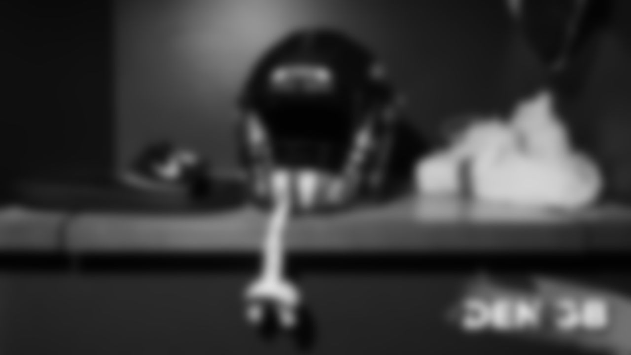 A helmet inside the locker room before the Broncos' Week 3 game against the Green Bay Packers on September 22, 2019 at Lambeau Field. (Photo by Ben Swanson)