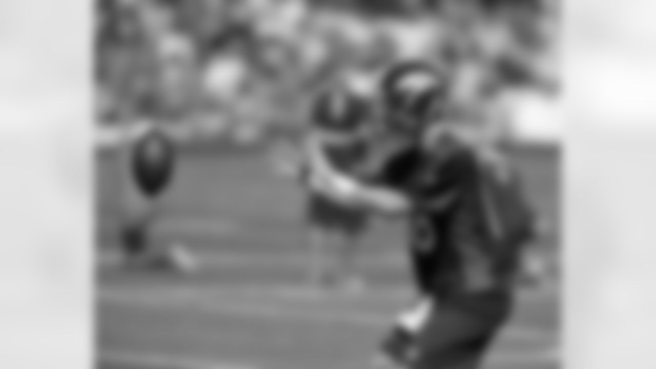 QB Peyton Manning takes a snap.