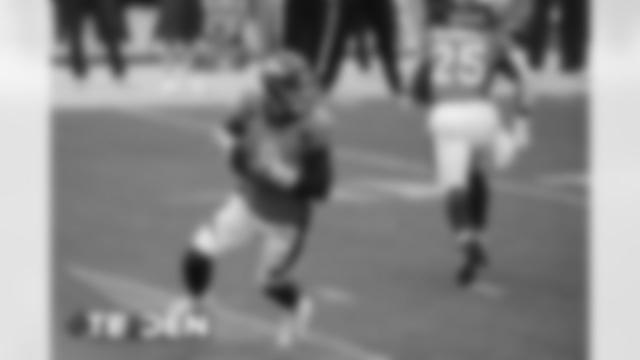 Jeff Driskel scrambles during the first half of the Broncos' Week 3 game against the Tampa Bay Buccaneers at Empower Field at Mile High on September 27, 2020. (Photo by Ben Swanson)