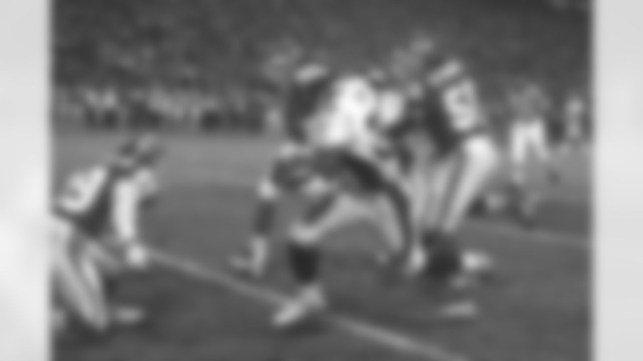 Kansas City: Terrell Davis has a long gain during a rush into Chiefs territory. This rush was a huge play in the game against the Kansas City Chiefs at Arrowhead Stadium in Kansas City, MO on January 4, 1998.