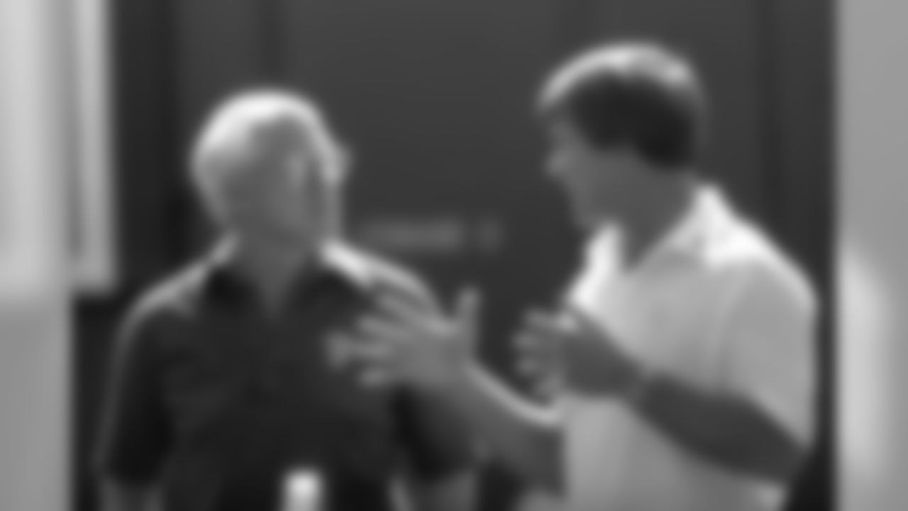 San Francisco head coach Bill Walsh talks with Broncos head coach Dan Reeves before a September 19, 1982 win (24-21) over the 49ers at Mile High Stadium.