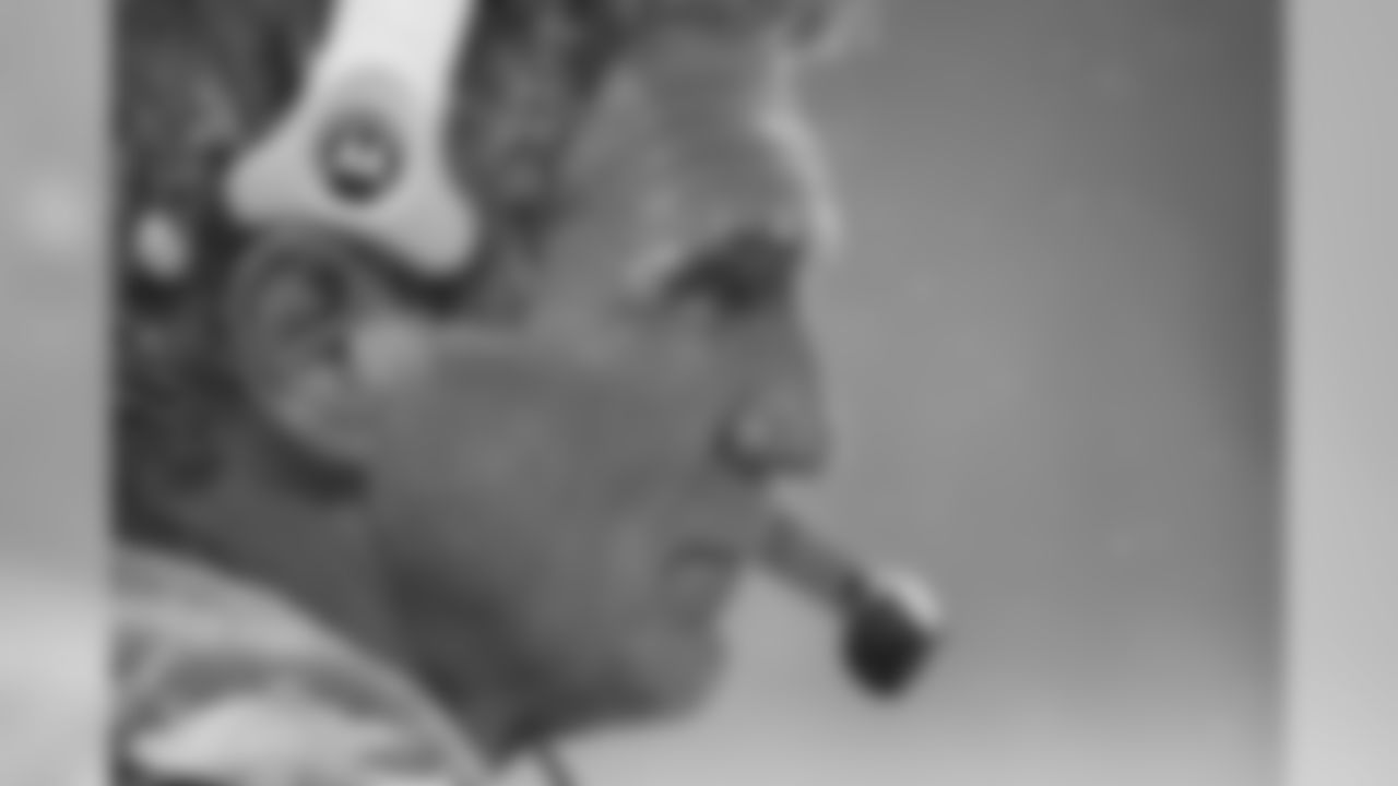 Mike Shanahan looks out on the field during game action against the Raiders in 2004.