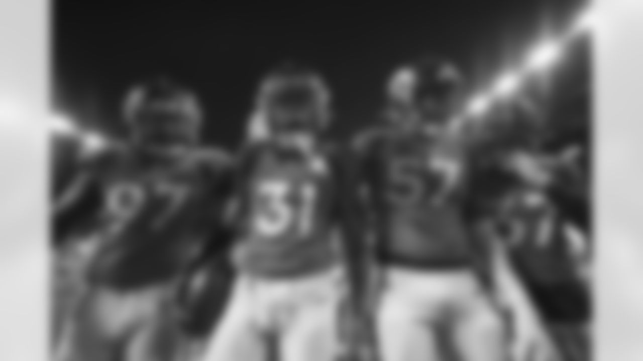 Denver Broncos linebacker Jeremiah Attaochu (97), safety Justin Simmons (31), defensive end DeMarcus Walker (57), safety P.J. Locke (37) celebrate after an interception during the NFL game against the Miami Dolphins at Empower Field at Mile High in Denver, Colorado, November 22, 2020.
Photo by Gabriel Christus