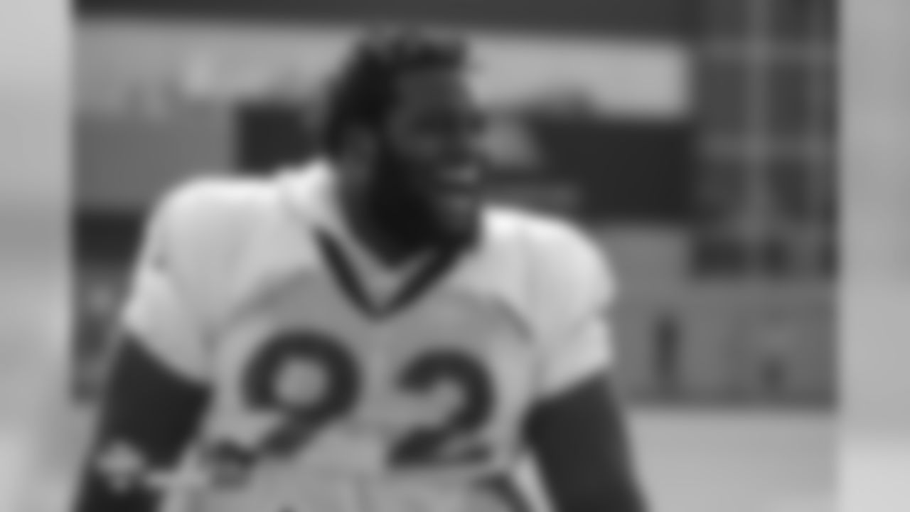 Defensive end Zach Kerr (92) laughs during the ninth day of training camp on August 7, 2018, at UCHealth Training Center.