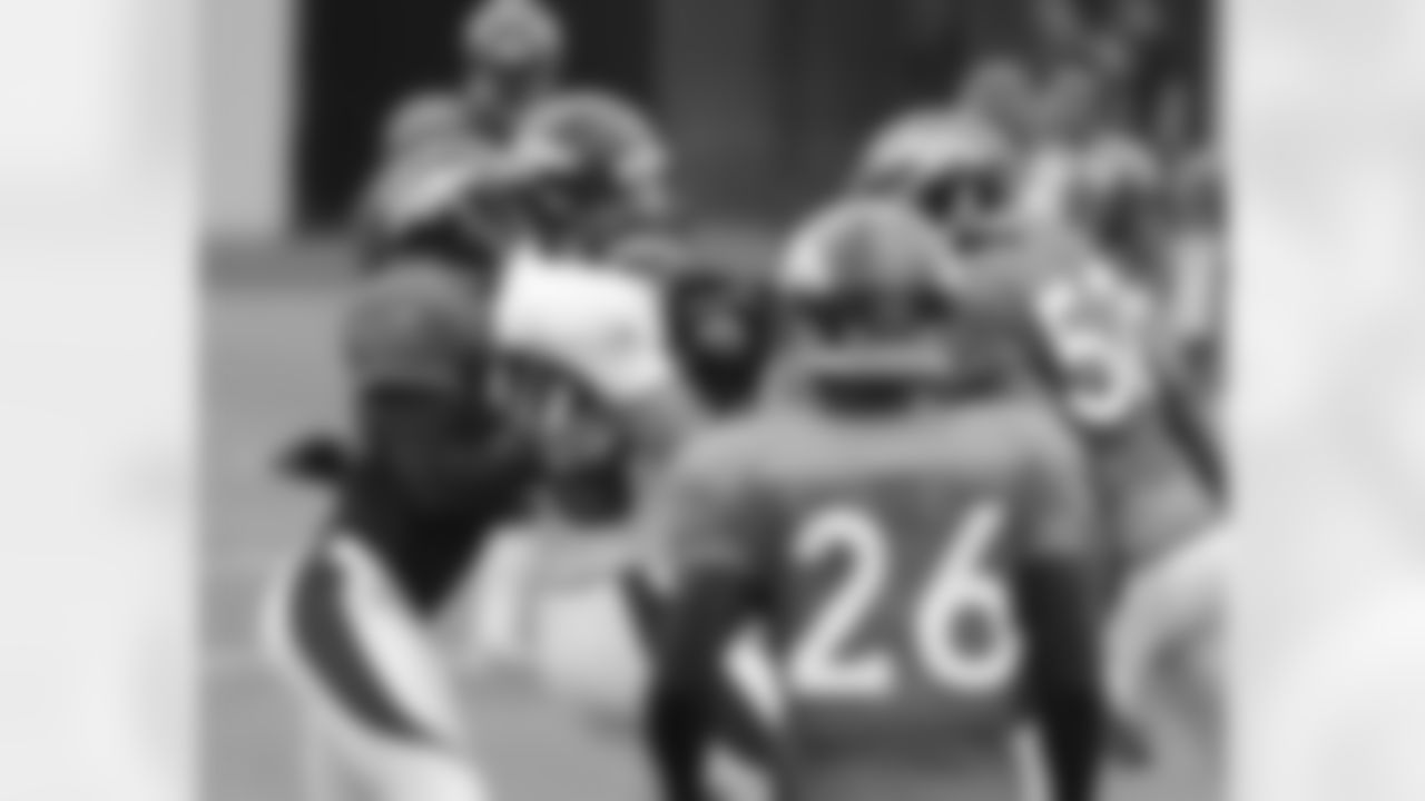 Decker is wrapped up by Mike Adams after a catch.